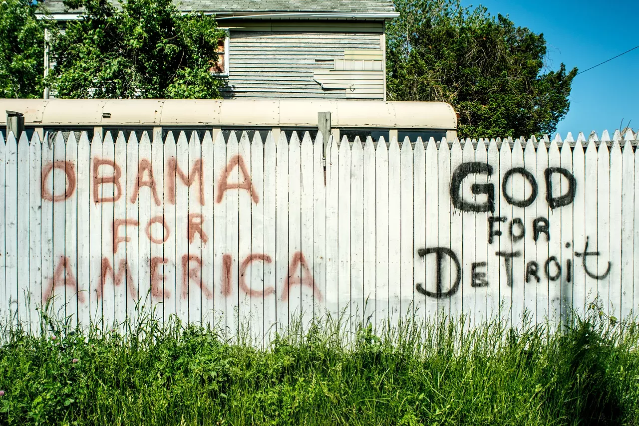 Vergara spotted this piece, which appears at Elmwood and East Forest in Detroit. While the message is quick and cryptic, Vergara notes that " When portrayed in the company of others, he most frequently appears with his wife Michelle Obama, Martin Luther King Jr., Malcolm X, Marcus Garvey, and Jesus Christ." The latter would seem to apply in this case.