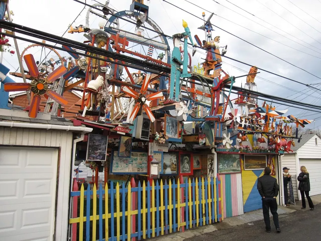 Hamtramck Disneyland Hamtramck, MI Built by former General Motors assembly line worker Dmytro Szylak, the assemblage of carved and found objects lights up at night and spins with Mickey Mouse in a plane, reindeer, dolls, toys, paint colors, and trilingual press clippings. Dmytro gives visitors a personal tour for a small donation. Photo via Flickr: Jerry Paffendorf