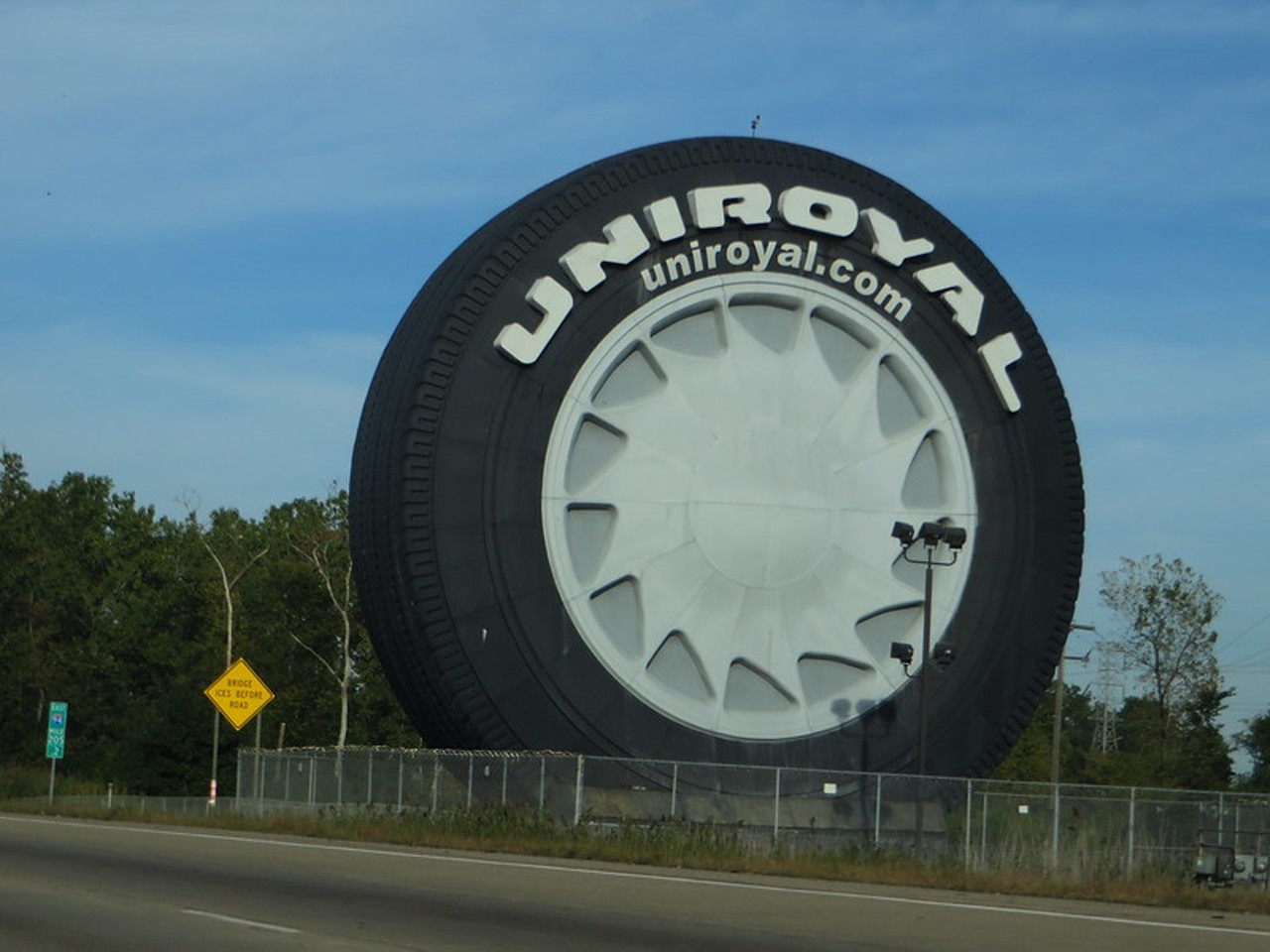 The Uniroyal Tire
I-94 east of Detroit Metro Airport in Allen Park
We're so sick and tired of being indoors that we are fully identifying with the energy of the Uniroyal Giant Tire featured along I-94 in Allen Park. The impossible-to-miss roadside attraction was used as a ferris wheel for the 1964 New York World Fair by the United States Rubber Company, where it serviced 2,000,000 riders. The 12-ton, 80-foot-tall attraction was moved to Allen Park in 1966. 
Ken Lund/Flickr Commons