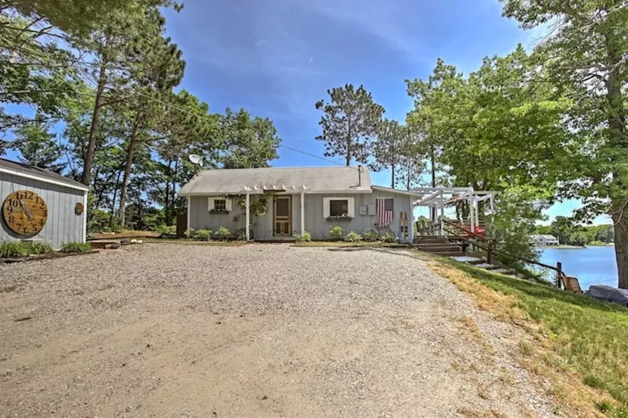Cozy Traverse City House with Private Beach6 guests, 2 bedrooms, 4 beds, 2 baths $293 per night Two words: private beach. At this cozy and rustic Traverse City property, you can listen to the sounds of the beach waves without budging from the porch. This 1,000-sq. ft. home features a wood-burning fire pit, fishing dock, hammock, a boat ramp for all you beautiful boaters. You can experience some much needed rest and relaxation on the shore of Silver Lake. Want to get wet? There are paddle boats, kayaks, and rowboats available for use. Photos via Airbnb.com