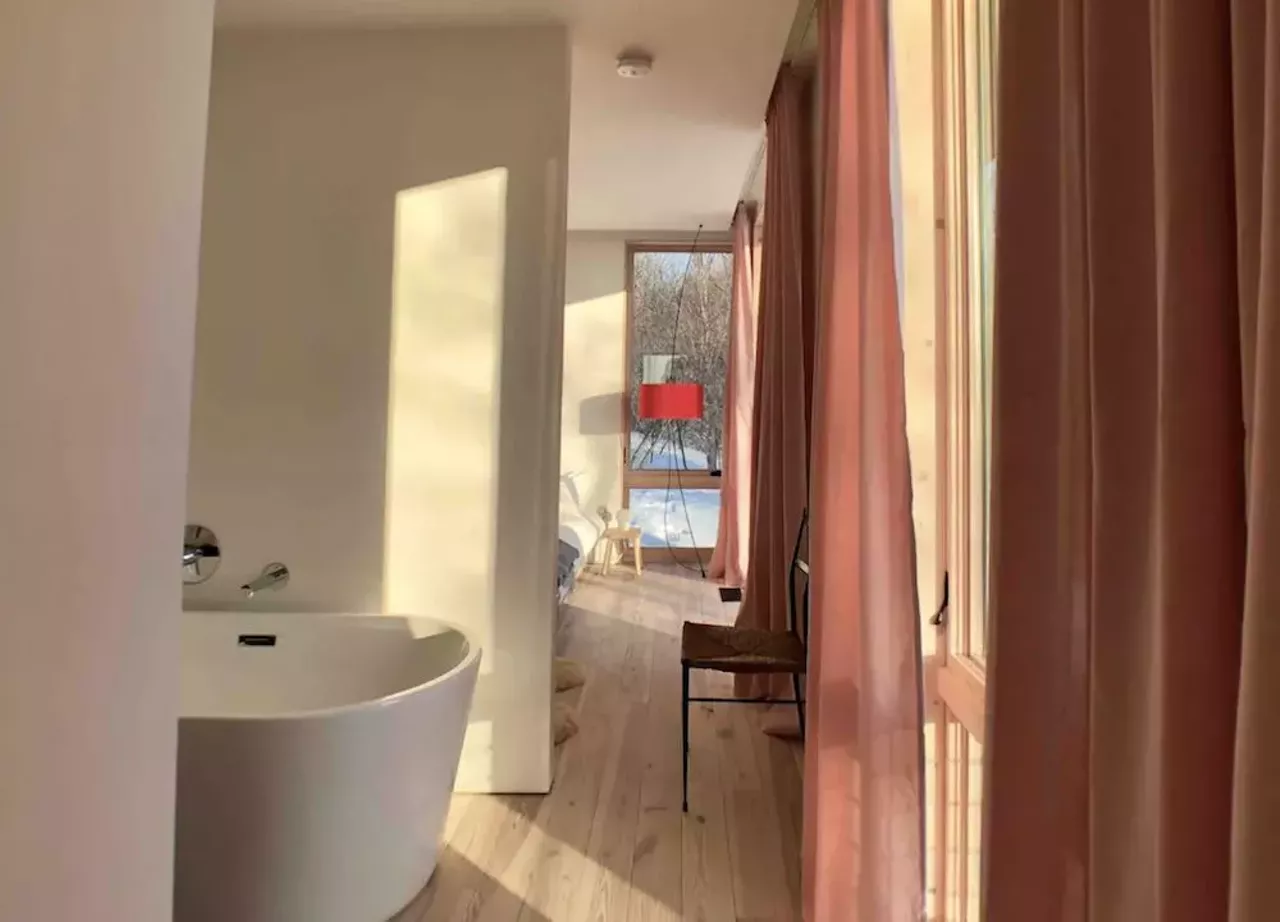 Seeblick Haus in Northport 6 guests, 3 bedrooms, 3 beds, 2 baths $410 per night Get your camera ready, honey: this house is ready for its closeup. Located on a 12-acre lot, this 2019 contemporary modernist cabin in Northport offers privacy and a 270 degree view of Grand Traverse Bay and the surrounding orchards. Offering an open floor plan, the Seeblick Haus boasts floor-to-ceiling windows and sleek design touches like a rain shower, an indoor wood-burning stove, and a color scheme that looks like a goddamn delicious pack of Starbursts. Within five miles of the home, there is access to Lake Michigan beach fronts, a goat farm, vineyards, doughnuts, a small-town grocer, and ice cream. Photos via Airbnb.com