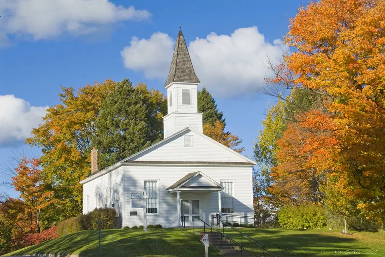 Omena, MI We all know that the fall colors are gorgeous everywhere, but nothing beats Up North. Omeana is located near Suttons Bay, right on the Grand Traverse Bay. Could you want anything more? Photo by Jim Sorbie via Flickr.