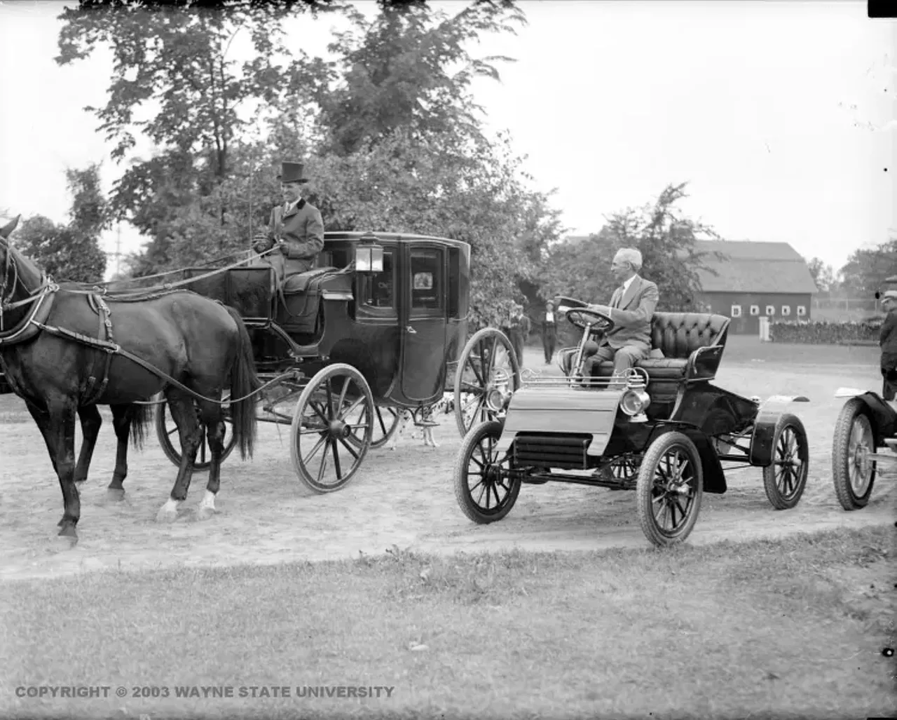 Henry Ford Driving Old Model Car Passing a Stage Coach from Virtual Motor City (Photo credit: Detroit News Collection, Walter P. Reuther Library, Wayne State University)