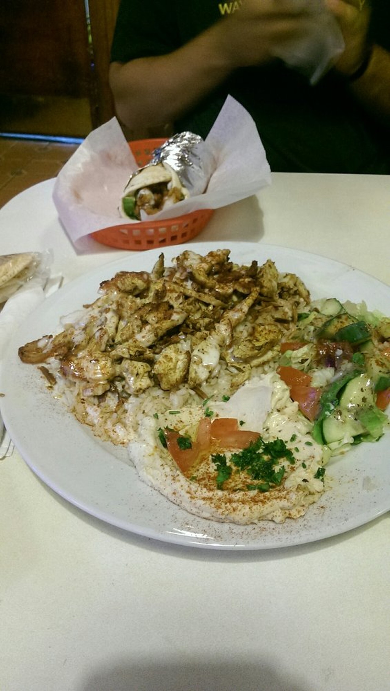 Shawarma | Harmonie Garden  | $9.99 
Detroit | 4707 Anthony Wayne Dr. | (313) 638-2345 
Served with a side of rice or fries, hummus, salad, and pita, this is definitely the best and most bang-for-your-buck shawarma around (sorry Bucharest). Perfect healthy meal for average Wayne State student budget. 
(Photo: Sarah R., via Yelp)