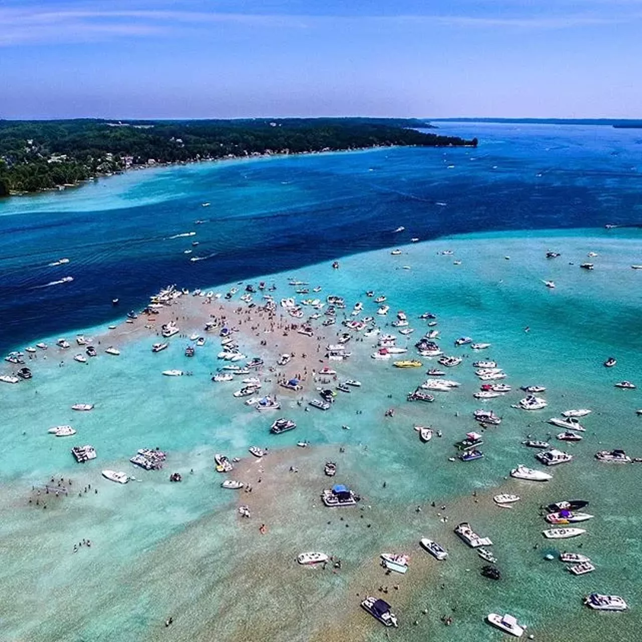 Torch Lake Michigan, Antrim County Torch Lake stretches longer than any other inland body of water in Michigan with a continuous flow of water for 19 miles. Known for its clear water with a splash of turquoise it&#146;s perfect for every aquatic adventure you had in mind.(Photo via Instagram, @detroitinvaderz)