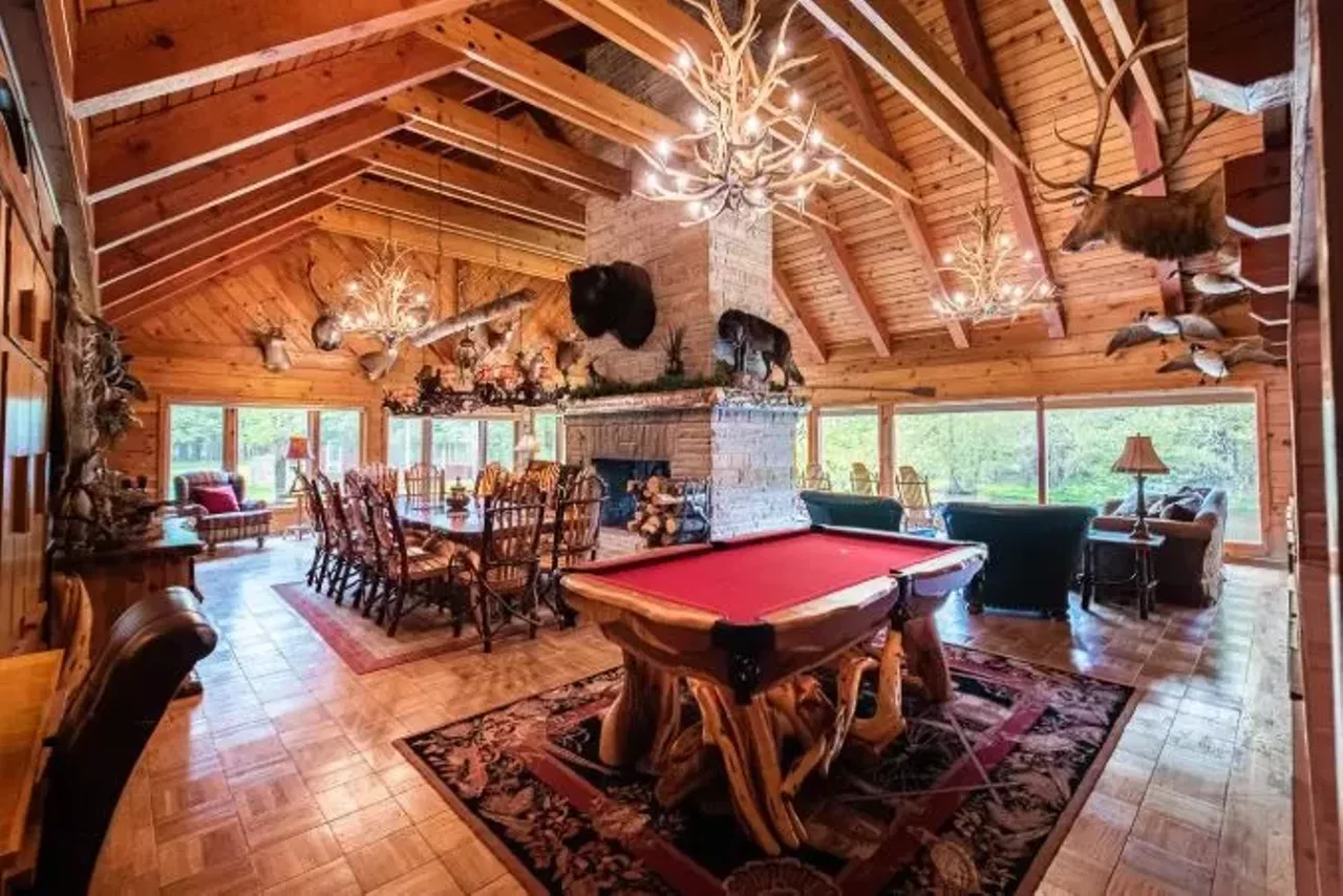The Royal Stag Lodge (Grayling) 16+ guests, 6 bedrooms, 3.5 baths $1,043 per night&nbsp; Dating to the 1940s, this one-of-a-kind spot has exposed beams, custom metal railings, mounted animal heads, and authentic pelts.&nbsp; Photo via Airbnb