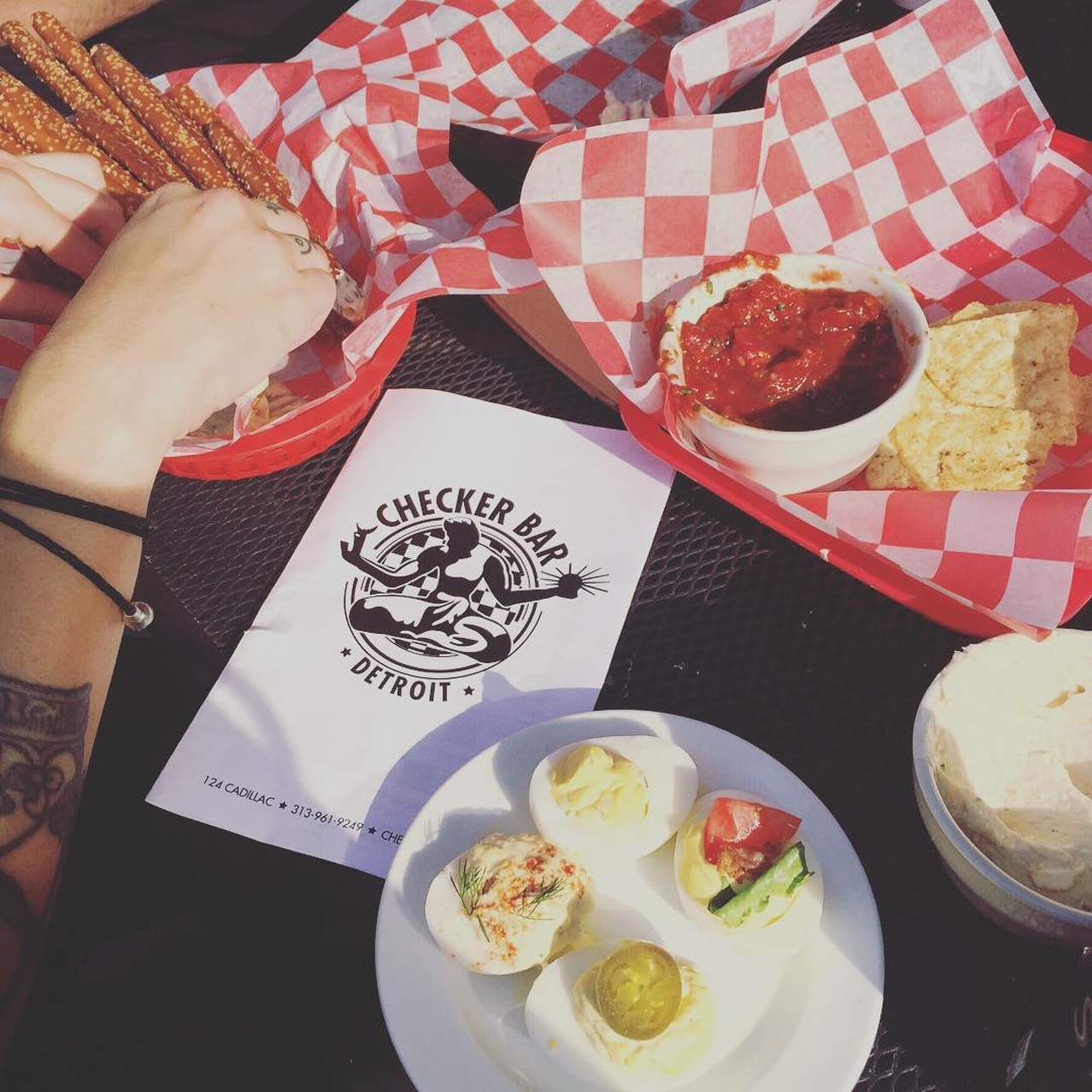 Checker Bar 
Detroit | 124 Cadillac Sq. | (313) 961-9249 
Simple yet delicious; traditional, jalapeno, BLT, and lobster topped deviled eggs. Oh, and try their sliders, too. Cheap and delicious.  (Photo: msupplyco, via Instagram)