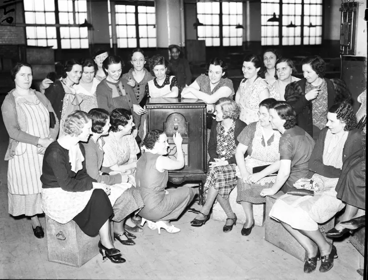 1930s | Striking workers pose at hair care products display at Woolworth store in Detroit, Michigan, during sit-down strike.