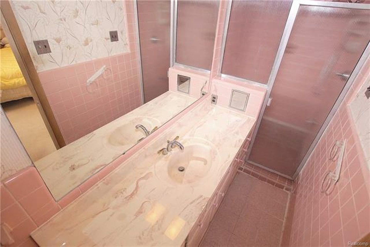 22739 North Bellwood Drive, Southfield 
4 beds, 3 baths, 2,483 square feet, $215,000 
Rose tint my world with this pink tiled bathroom.