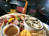 A bratwurst and knockwurst platter, with a black and blue beer. - MT Photo: Rob Widdis