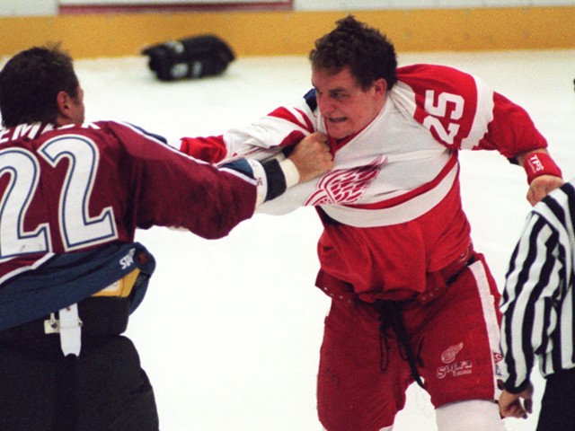 Detroit Red Wing Darren McCarty and Colorado Avalanche Claude Lemieux duke it out three seconds into Tuesday night's game at Joe Louis Arena, Nov. 11, 1997.