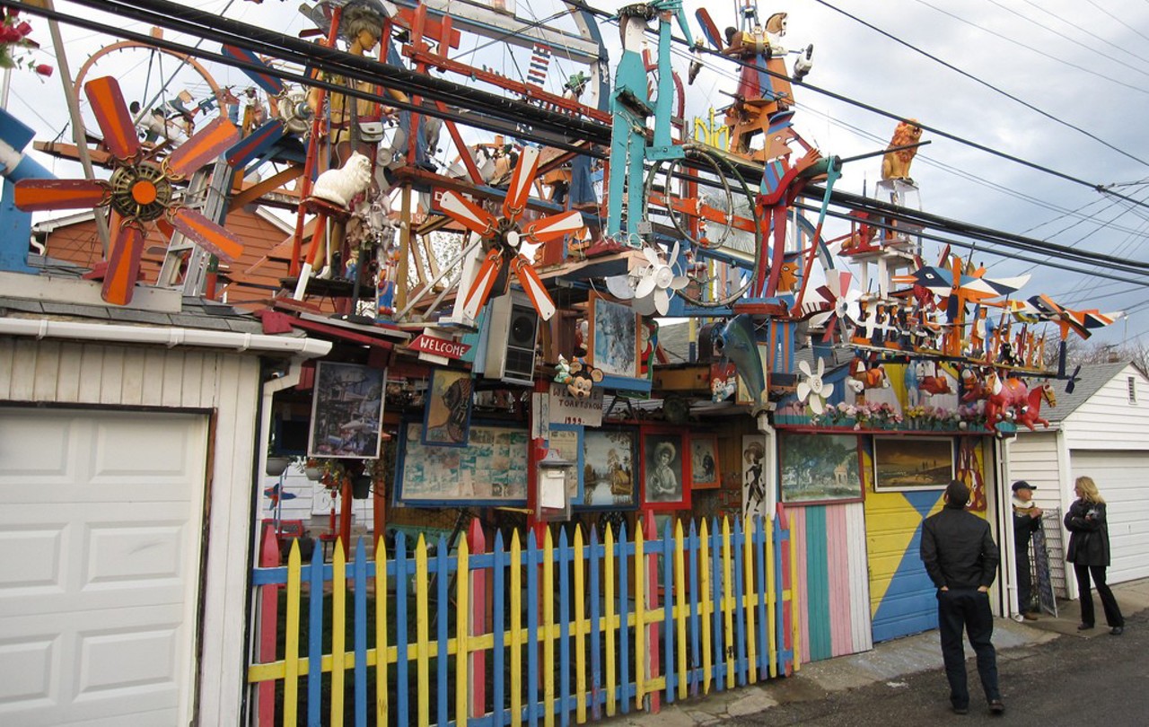 Hamtramck Disneyland
(In the alley behind 12087 Klinger St., Hamtramck)
The so-called "Hamtramck Disneyland" was created over the course of more than 20 years by the late Dmytro Szylak, a retired General Motors auto worker who began installing this Rube Goldberg-esque amalgamation of moving parts in his own backyard in 1992. After Szylak died in 2015, the fate of the installation was in jeopardy, but an arts group eventually bought the property. While much of the art has been removed for repairs, we're told it should begin to return by the spring. (Photo by Jerry Paffendorf, Flickr Creative Commons)