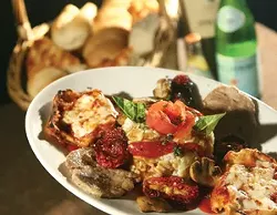 A three item combination: Eggplant, risotto Milanese with mushroom sause and veal Pomodoro, served with housemade bread. - MT Photo: Rob Widdis.