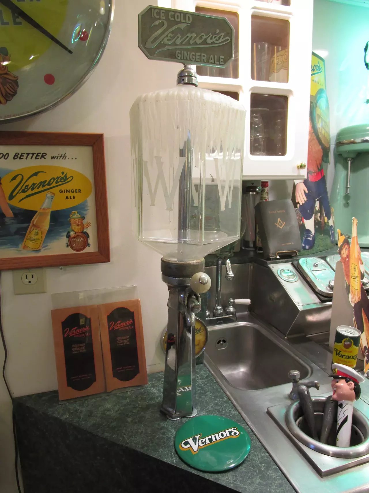 Wunderlich says that this frosty-looking vessel was a gimmick designed to make people thirsty, but didn't actually contain ginger ale: "That was one of their very early dispensers. It probably first appeared in the 1920s, but they still used them in the 1940s. The glass up above was supposed to hold a yellow Vernor's-ish-looking liquid, but it wasn&#146;t Vernor's. The Vernor's just came up from a refrigerated unit underneath, through the handle. They had somehow rigged it up, so when you did pull the handle down, it would release some air into the colored water, to make it look like something was actually happening, but Vernor would never have allowed that to actually be Vernor's. "