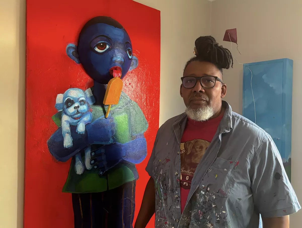 Image: Donald Calloway with one of his “Blue babies” paintings.