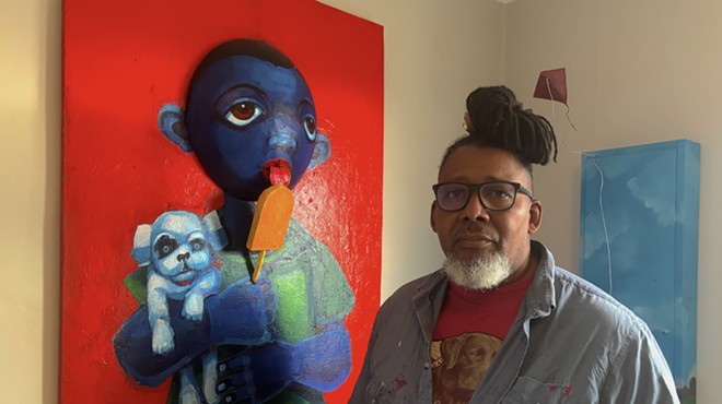 Donald Calloway with one of his “Blue babies” paintings.