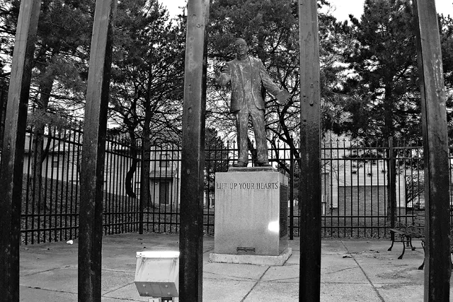 Activist priest Fr. Clem Kern�s statue is in locked pocket park. - MT photo: W. Kim Heron