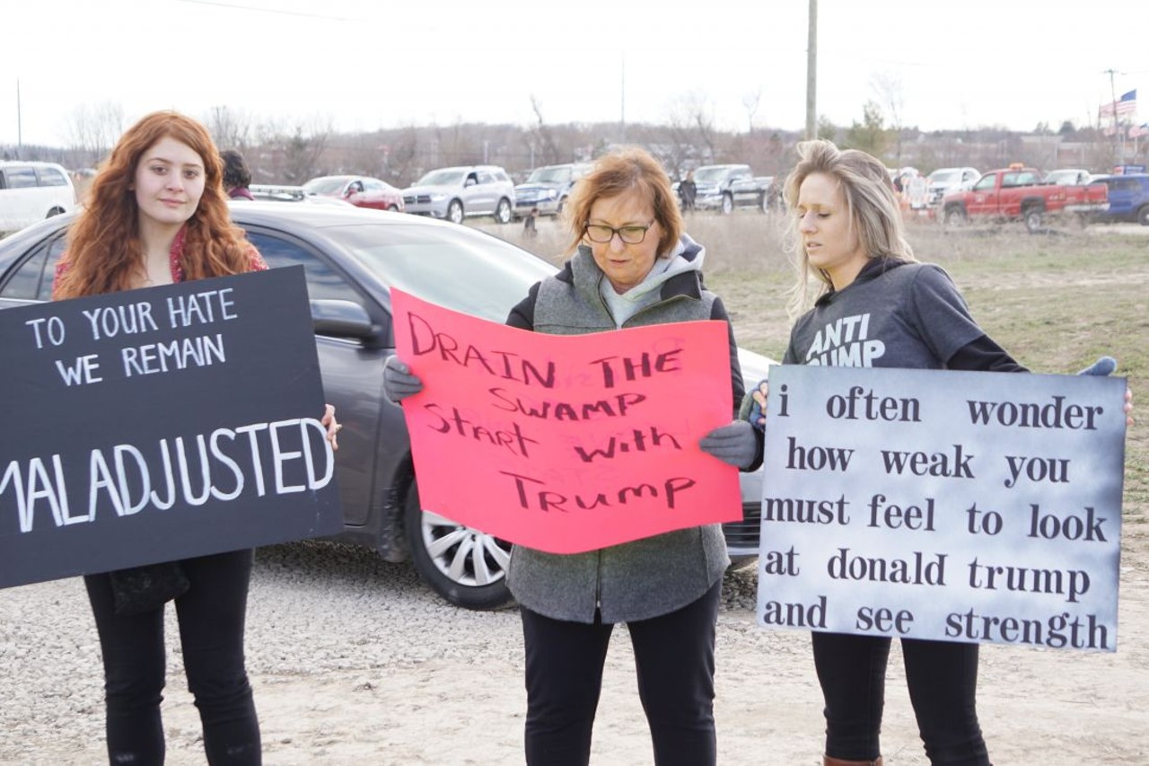 All the protest signs we saw at Trump's Washington, Mich. rally