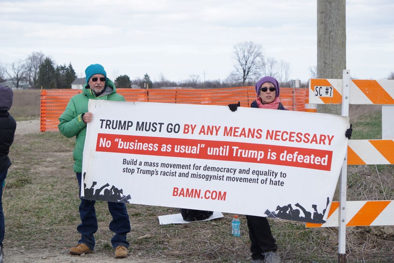 All the protest signs we saw at Trump's Washington, Mich. rally