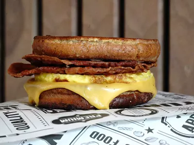 The breakfast sandwiches at A.M. Buzz include bacon, egg, and cheese served on French toast.