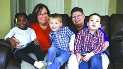 April DeBoer and Jayne Rowse, who are challenging Michigan’s ban on same-sex adoption, with their three ‘foster’ children.