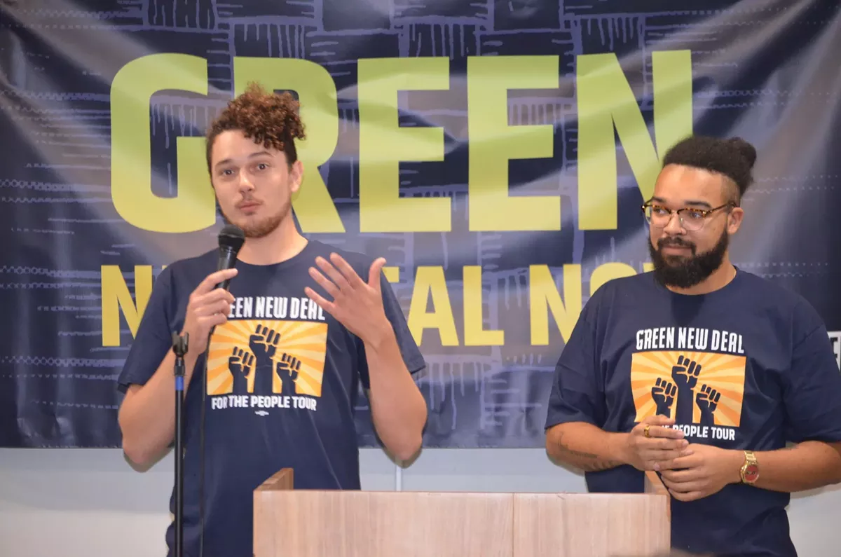 Image: Saul Levin, Green New Deal Network legislative and policy director, (pictured on the left) addressed those who attended Sunday’s “Green New Deal for Michigan” rally in Dearborn. Mikal Goodman, campaign manager at Michigan Alliance for Justice in Climate, is shown on the right.