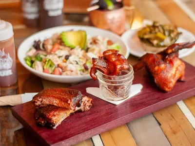 BBQ trio with turkey salad and greens.