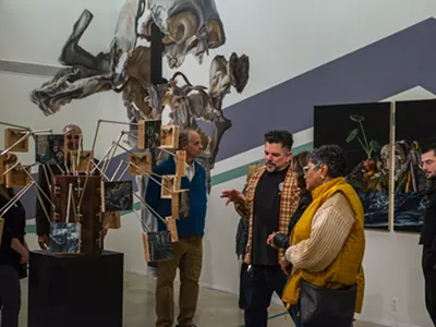 Museum-goers check out Bakpak Durden's The Eye of Horus exhibit.