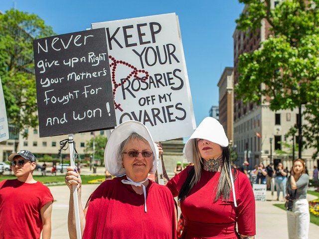Pro-choice protesters in Lansing dressed as characters from The Handmaid's Tale.