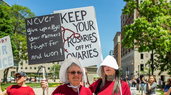 Pro-choice protesters in Lansing dressed as characters from The Handmaid's Tale.