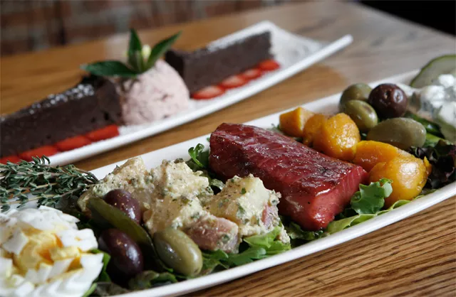 Beet-cured salmon nicoise, front, and &quot;Chocolate Decadence,&quot; back, from the Ravens Club in Ann Arbor. - MT photo: Rob Widdis