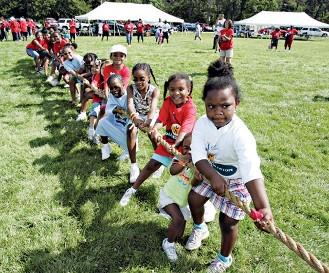 Belle Isle tug-of-war and the MLK High School marching band during past Neighborhoods Days.