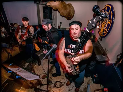 Mark Paul (at right), aka Captain Don River, with his bawdy band of salty seamen, Captains of the Head.