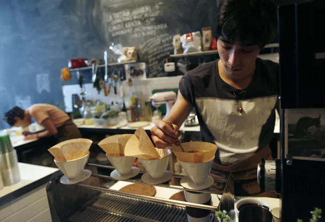 Ben Saginaw prepares pour over drip coffee at Astro Coffee in Detroit. - Photo: Rob Widdis