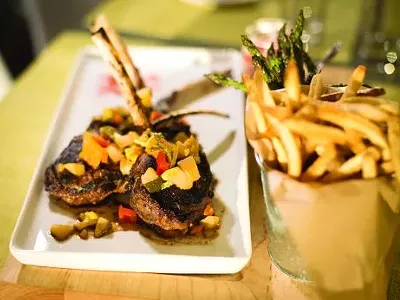 Butcher block with Colorado lamb chops from Bistro Joe’s in Birmingham.