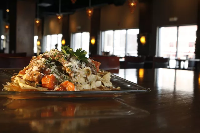 Braised lamb with pappardelle pasta and braised vegetables in natural pan sauce from the Metropolitan Caf&eacute; in Shelby Township. - MT photo: Rob Widdis