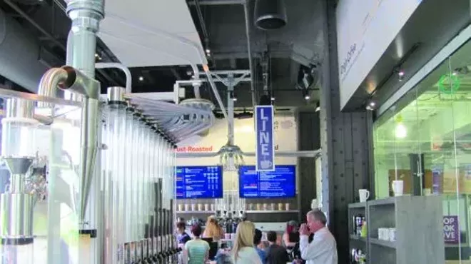 Like a scene from some sci-fi flick, pneumatic tubes crisscross the store, delivering fresh coffee beans for roasting.