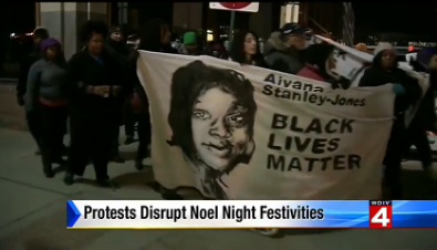 By the way, big ups to WDIV newscaster Priya Mann for declaring that "there were no arrests; this was a very peaceful protest," despite WDIV's caption implying otherwise. - Screengrab from WDIV news