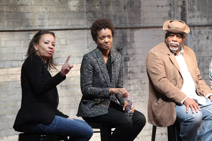 Catherine Kelly, left, publisher of the Michigan Citizen, moderated a panel discussion on gentrification in Detroit on Saturday, April 26, with speakers that included Lauren Hood, middle, of Loveland Technologies and Deep Dive Detroit, and George N'Namdi, right, of the N'Namdi Center for Contemporary Art. - Photo by Ryan Felton.