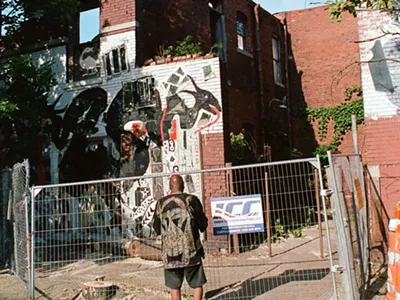 Olayami Dabls looks at his collapsed MBAD African Bead Museum building before it gets demolished.