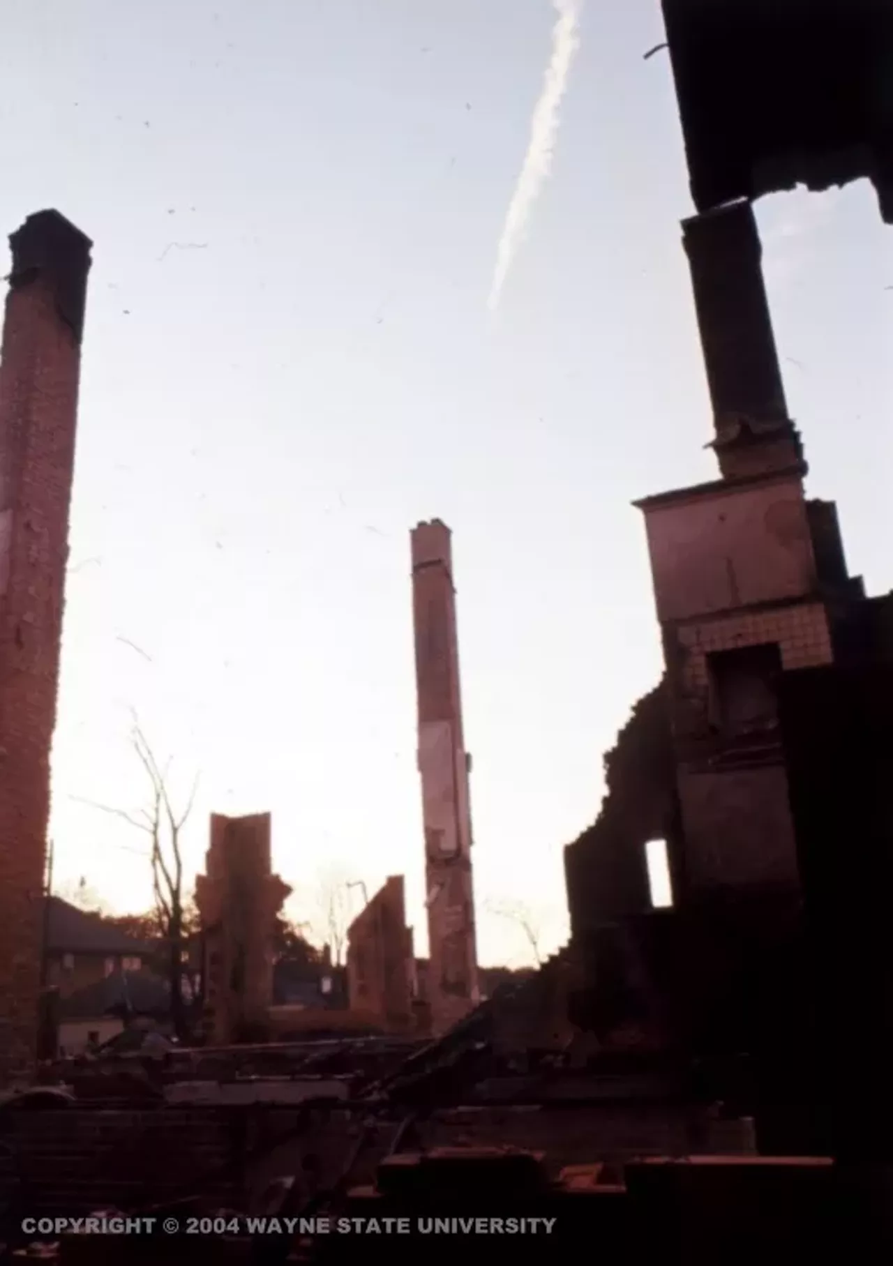 Only chimneys remained of houses burnt to the ground, standing tall above the rubble. 
