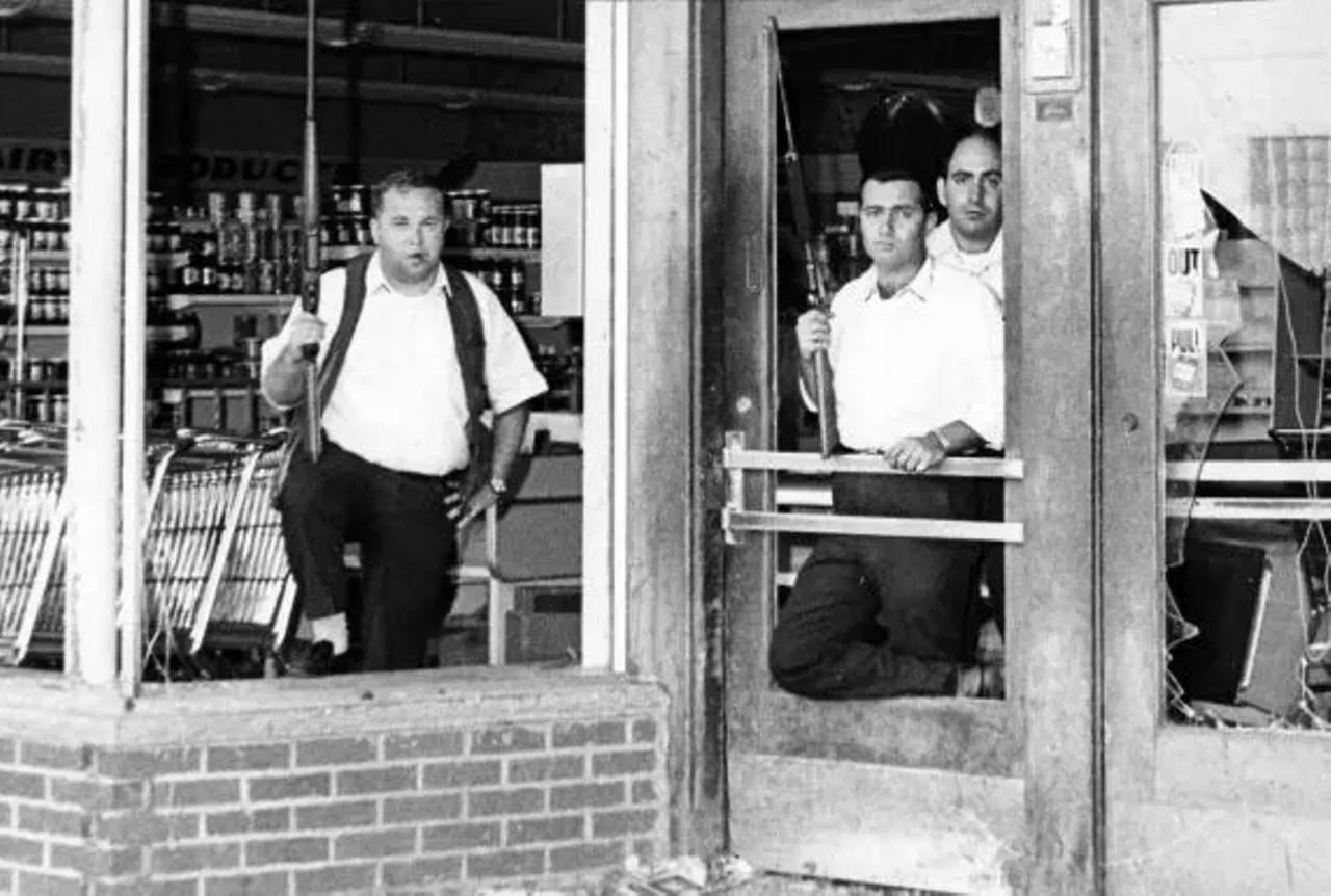 Looting and vandalism ravaged business districts as overwhelmed Detroit Police failed to stem the growing unrest. Some store owners took up arms to protect their own businesses when the authorities failed to do so. 