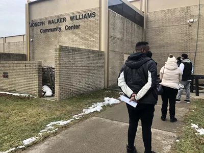 Detroiters wait in line to get a COVID-19 test at Joseph Walker William Community Center.