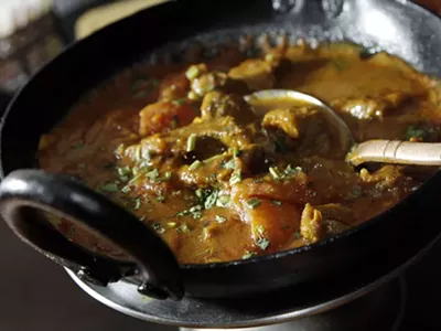 Karai lamb and &quot;Chicken Tikka Masala Sizzler,&quot; from Mazza Indian Cuisine in Berkley.