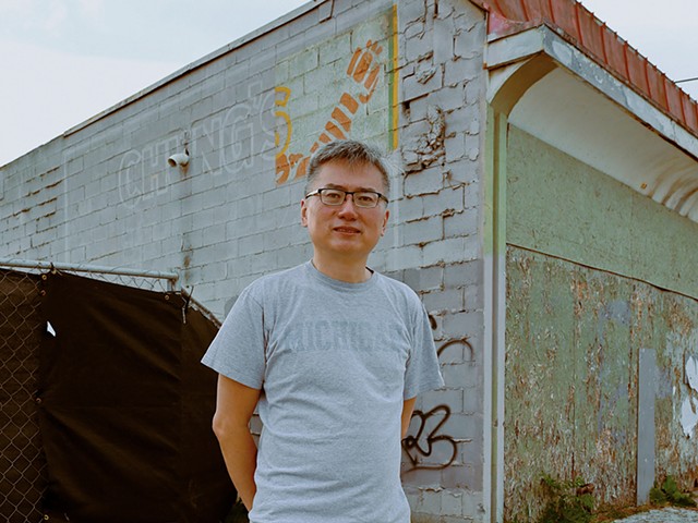 Curtis Chin stands outside his parents’ former Cass Corridor restaurant, Chung’s Cantonese Cuisine.