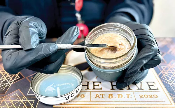 A budtender scoops out live rosin from the Hive’s unique deli.