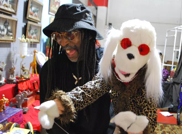 Darrell Banks lip-syncing with his puppet Diamond inside his booth. - Detroitblogger John