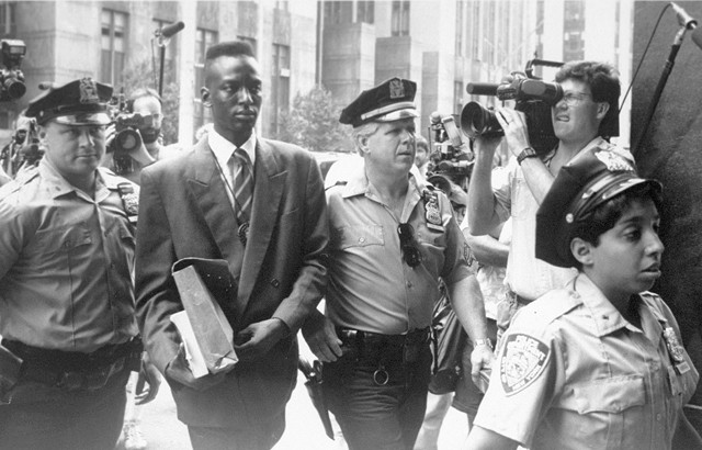 Defendant Yusef Salaam being escorted by police in 1990. The media circus was part of the problem.