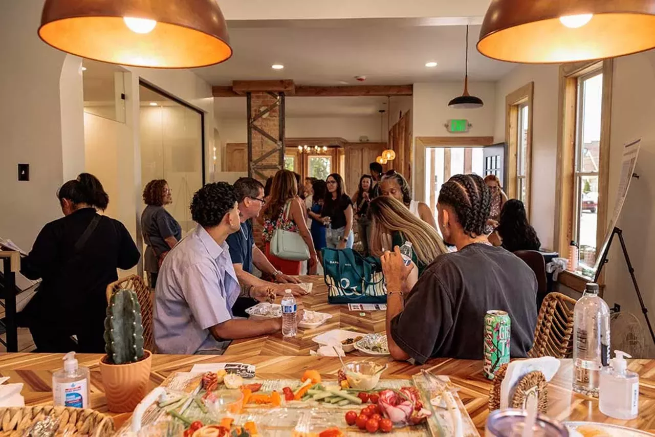 Attendees gather inside the Design Build Green Tech Hub during the grand opening event on September 14, 2024.