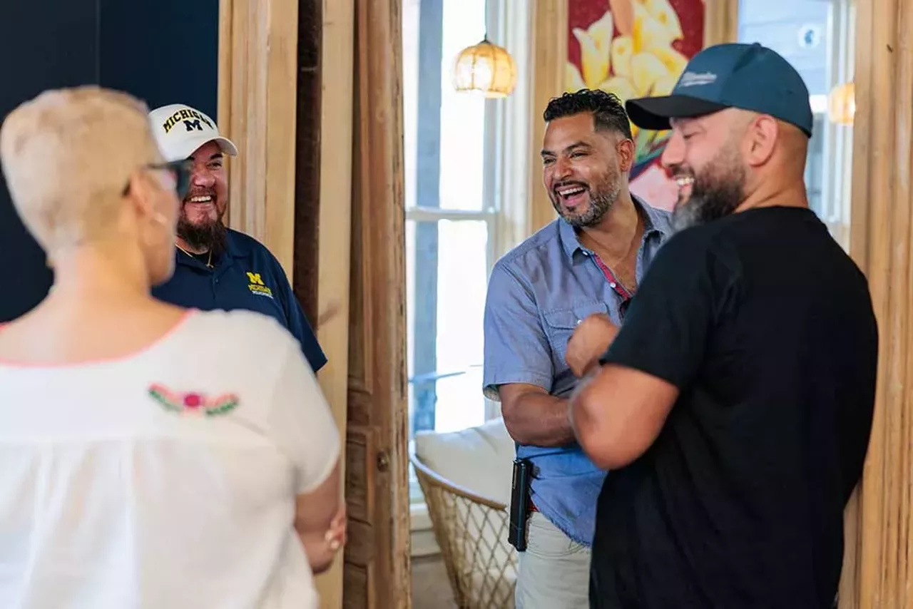 Luis Ali (center) speaks with attendees at the grand opening of the Design-Build Green Hub on September 14, 2024.